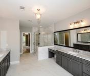 Large Master Bath with Marble Floors & Counter Tops in this Sandy Springs home by Waterford Homes